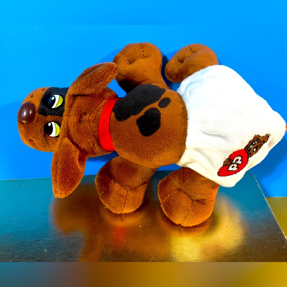 POUND PUPPIES NEWBORN WITH EMBROIDERED LOGO ON DIAPER & RED COLLAR 8”